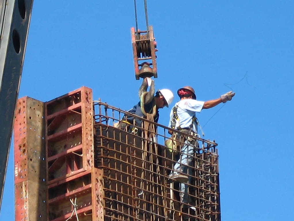 Site worker wearing a hard hat and protective clothing